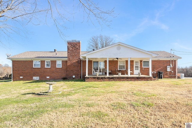 back of property with ceiling fan, central AC, a patio, and a yard