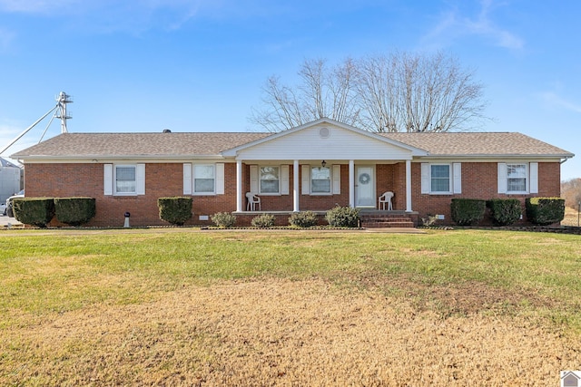 single story home featuring covered porch and a front yard