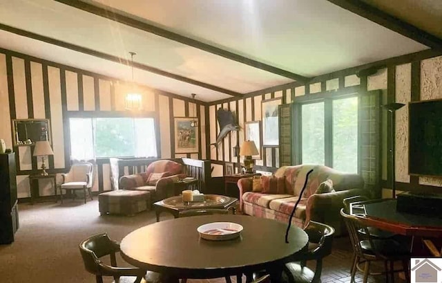 interior space with carpet floors and lofted ceiling with beams