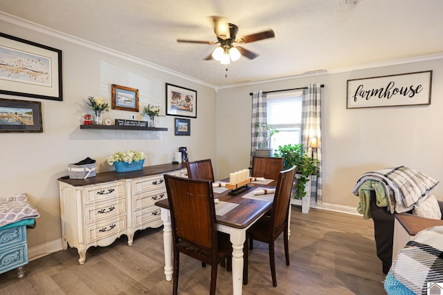 dining area with a textured ceiling, ceiling fan, crown molding, and hardwood / wood-style floors