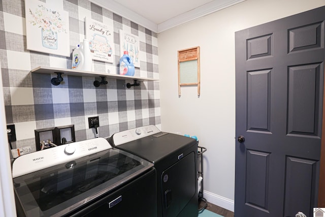 washroom featuring washer and clothes dryer and crown molding