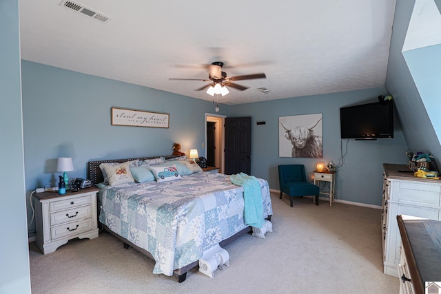 bedroom with ceiling fan and light carpet