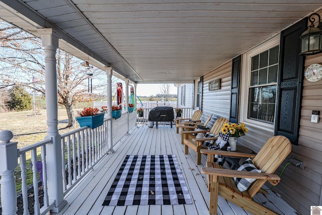 wooden deck featuring covered porch