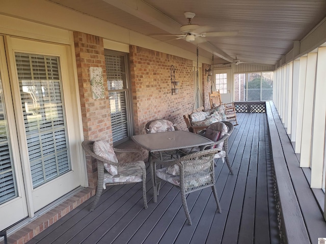 wooden terrace featuring ceiling fan