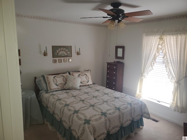 carpeted bedroom with ceiling fan