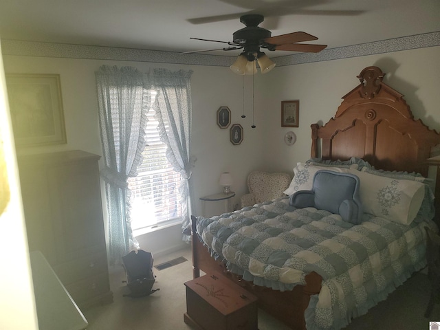 bedroom featuring ceiling fan and carpet floors