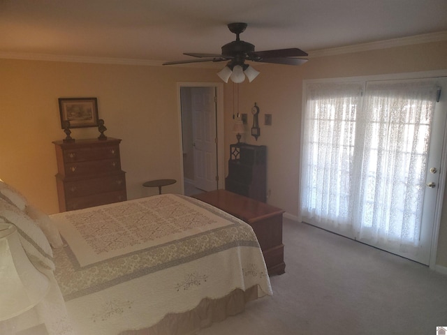 bedroom with ceiling fan, carpet flooring, and ornamental molding