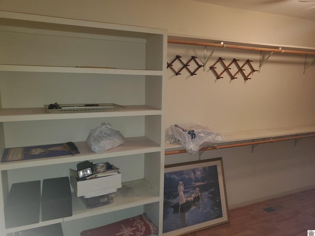 walk in closet featuring hardwood / wood-style floors