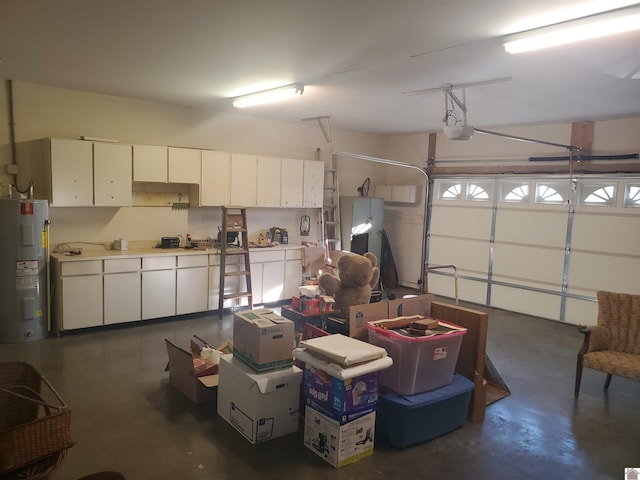 garage featuring water heater and a garage door opener