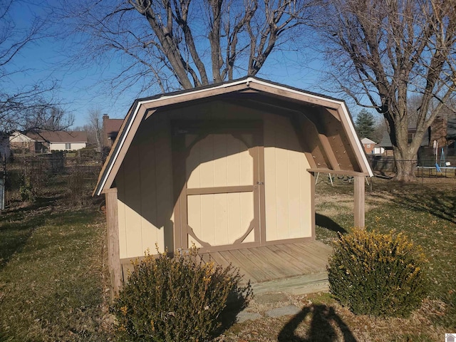 view of outdoor structure featuring a lawn