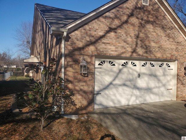 view of side of home featuring a garage