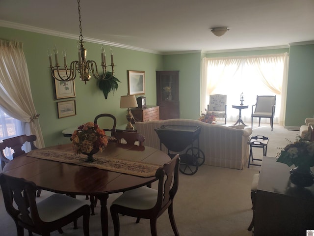 carpeted dining area with ornamental molding and a chandelier