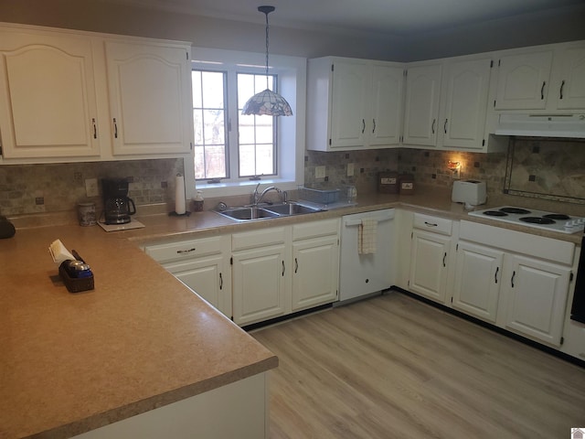 kitchen featuring white appliances, white cabinetry, pendant lighting, and sink