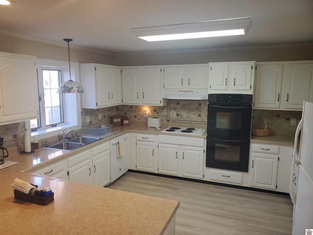 kitchen with tasteful backsplash, pendant lighting, sink, white appliances, and white cabinetry