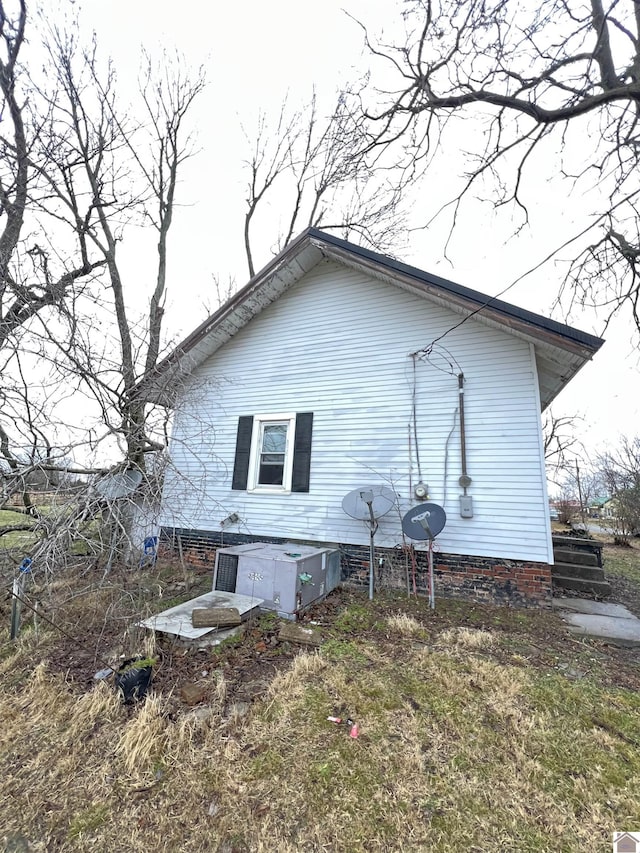 view of home's exterior with crawl space