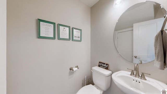 bathroom with sink and toilet