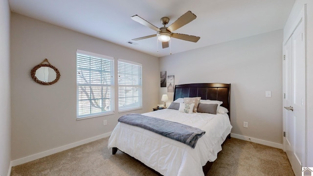 bedroom with light carpet and ceiling fan