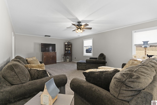 carpeted living room with ceiling fan, plenty of natural light, and ornamental molding