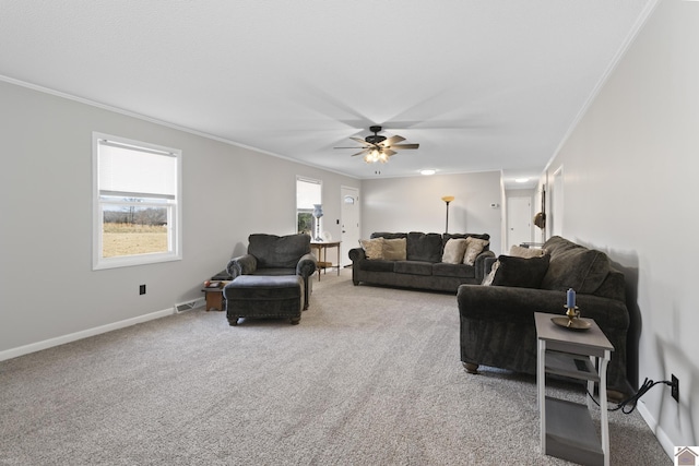 carpeted living room featuring ceiling fan and ornamental molding