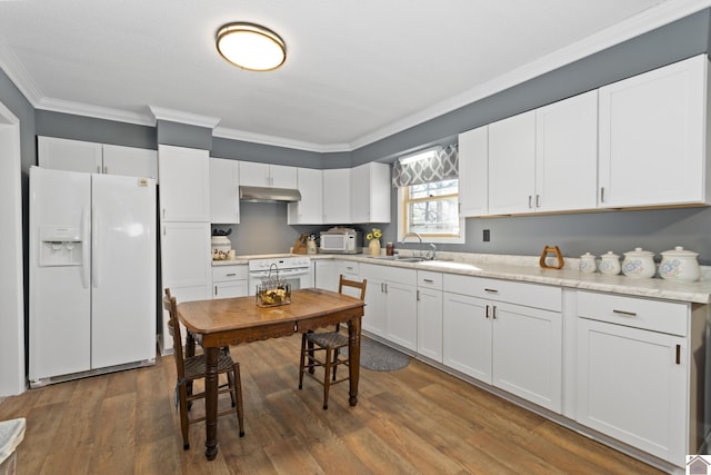 kitchen with dark hardwood / wood-style floors, sink, white appliances, and white cabinetry