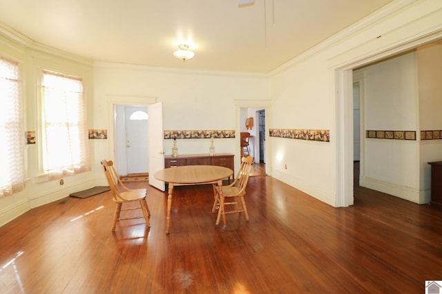 dining area featuring hardwood / wood-style flooring and ornamental molding