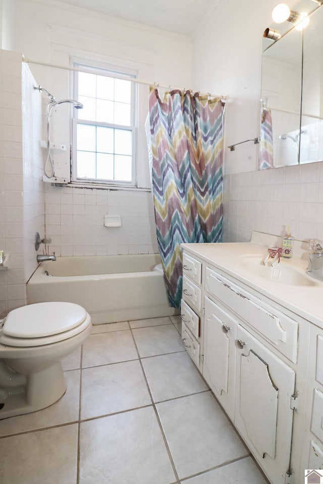 full bathroom featuring tile patterned flooring, tile walls, vanity, and shower / tub combo with curtain