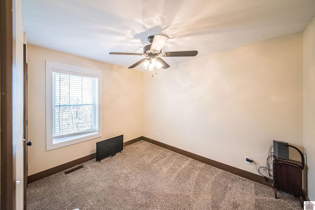 carpeted empty room with ceiling fan