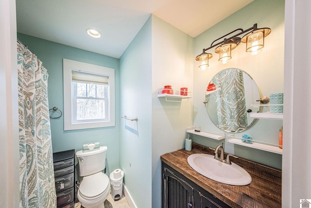 bathroom with toilet and vanity