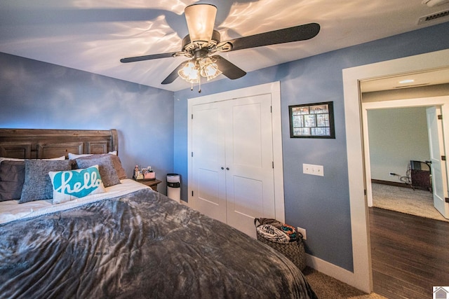 bedroom with ceiling fan and a closet