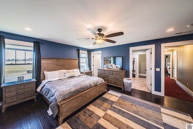 bedroom featuring ceiling fan and dark hardwood / wood-style flooring