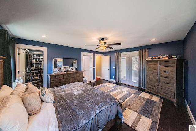 bedroom with dark hardwood / wood-style floors and ceiling fan