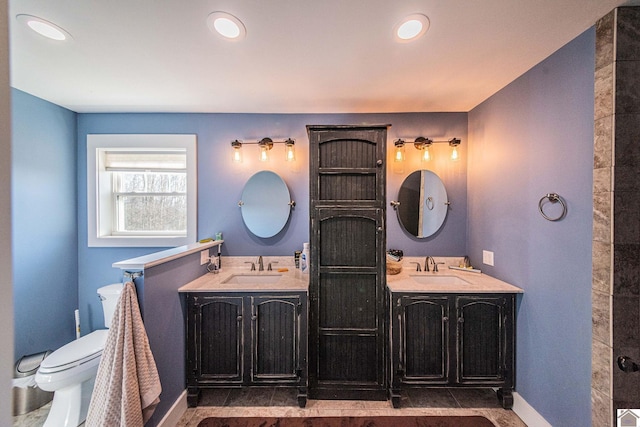 bathroom with toilet and vanity