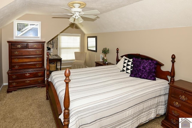 bedroom with light carpet, ceiling fan, a textured ceiling, and lofted ceiling