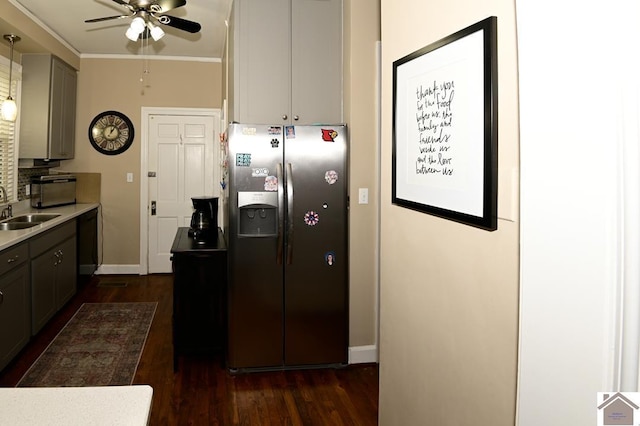 kitchen featuring black dishwasher, dark hardwood / wood-style flooring, sink, stainless steel fridge, and gray cabinets