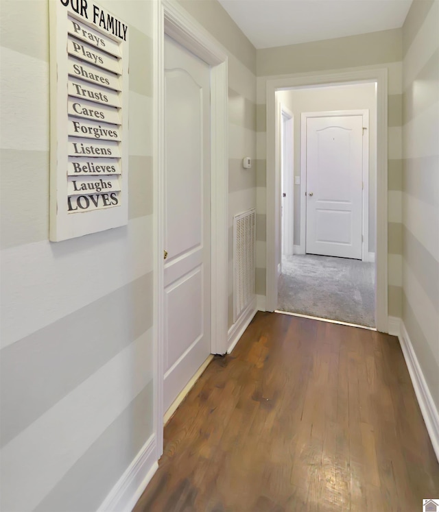 hallway featuring dark hardwood / wood-style floors