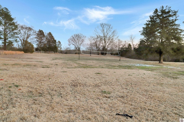 view of yard featuring volleyball court and a rural view