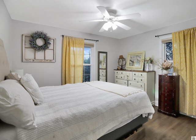 bedroom featuring dark hardwood / wood-style floors and ceiling fan