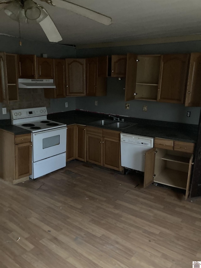 kitchen featuring ceiling fan, sink, white appliances, and light wood-type flooring