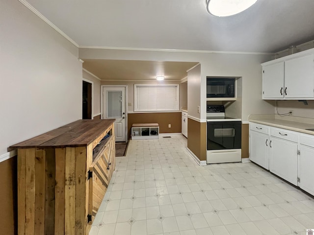 kitchen with crown molding, white electric range oven, white cabinetry, butcher block countertops, and black microwave