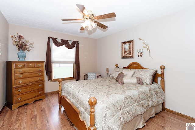 bedroom featuring ceiling fan and light hardwood / wood-style floors