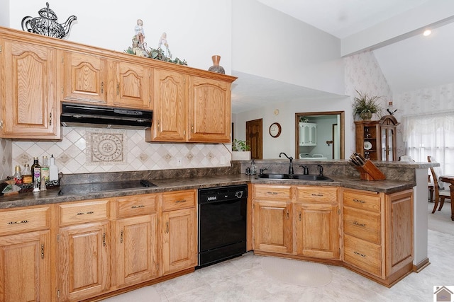 kitchen featuring kitchen peninsula, vaulted ceiling, sink, tasteful backsplash, and black appliances