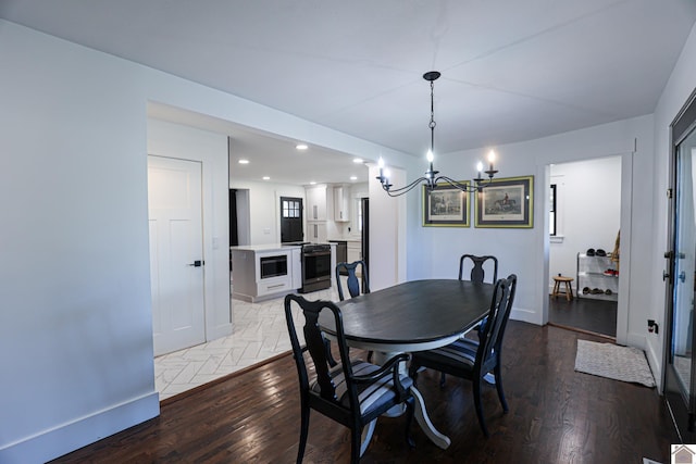 dining space featuring a notable chandelier and light hardwood / wood-style flooring