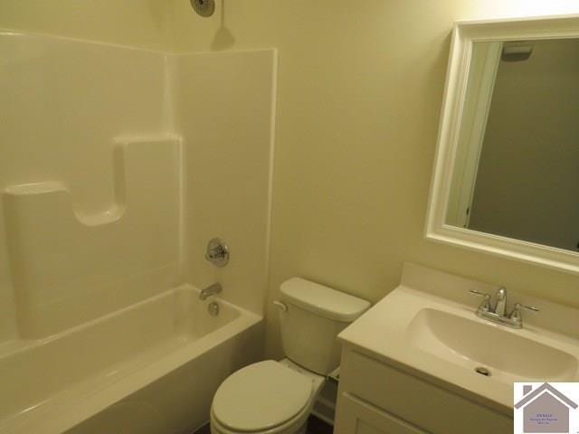 full bathroom featuring toilet, vanity, and bathing tub / shower combination