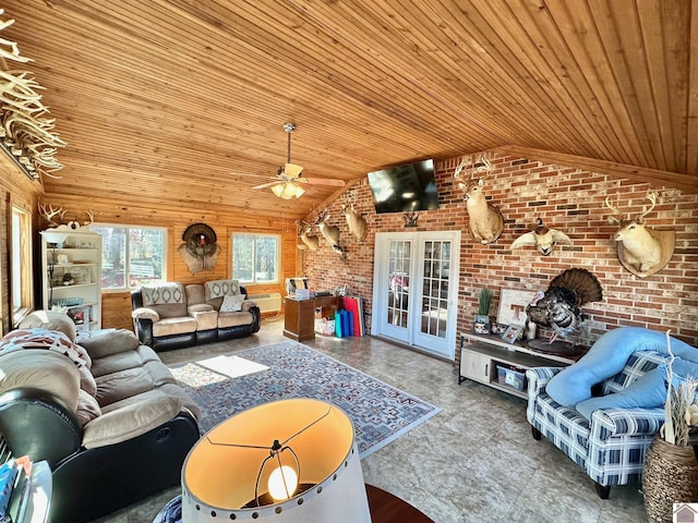 living room with french doors, lofted ceiling, wooden ceiling, ceiling fan, and brick wall