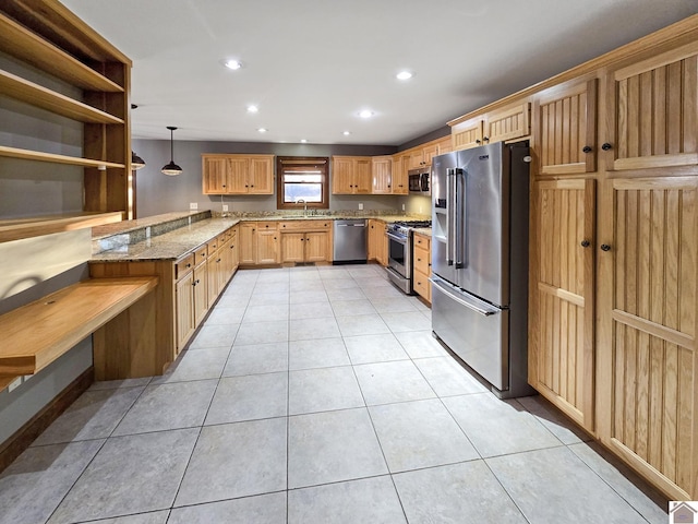 kitchen with hanging light fixtures, light tile patterned floors, stainless steel appliances, and sink