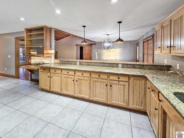 kitchen with pendant lighting, light tile patterned floors, light stone counters, and kitchen peninsula