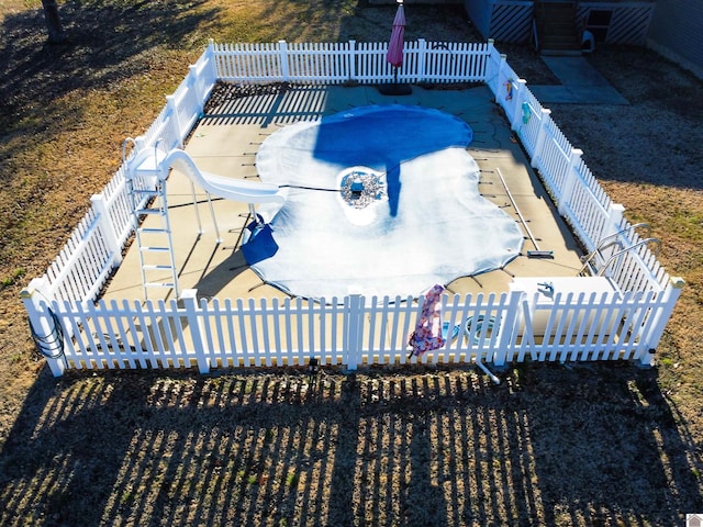 view of swimming pool with a patio area