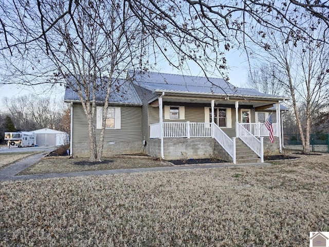 view of front of property with a porch and a front yard