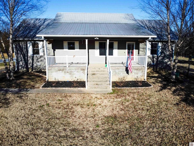 view of front of home with covered porch and metal roof