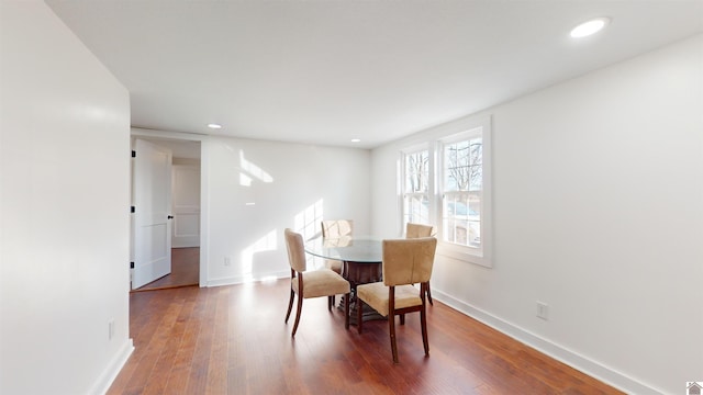 dining space featuring hardwood / wood-style flooring